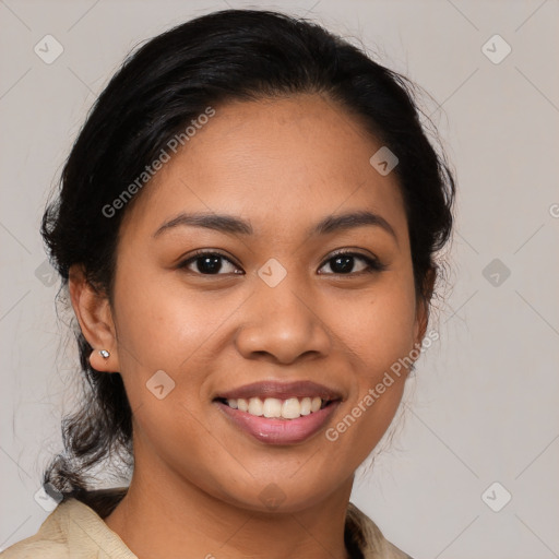 Joyful latino young-adult female with medium  brown hair and brown eyes