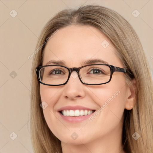 Joyful white young-adult female with long  brown hair and green eyes