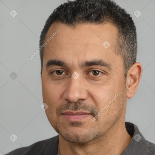 Joyful white adult male with short  black hair and brown eyes