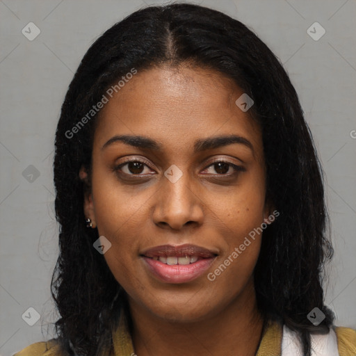 Joyful black young-adult female with long  black hair and brown eyes