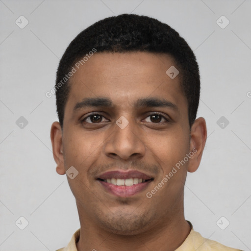 Joyful latino young-adult male with short  black hair and brown eyes