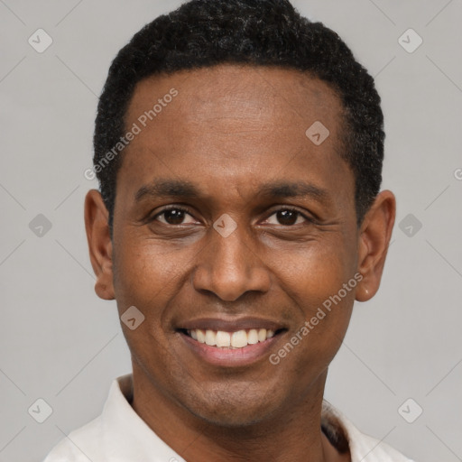 Joyful latino adult male with short  black hair and brown eyes