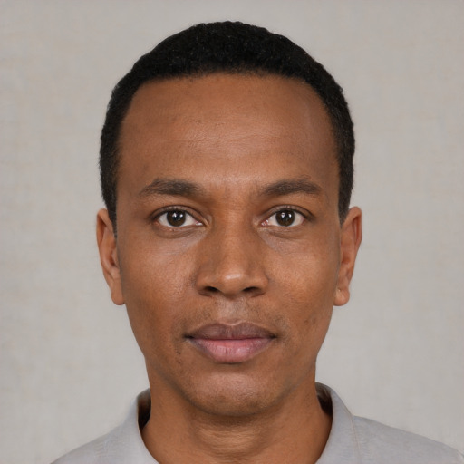 Neutral black young-adult male with short  black hair and brown eyes