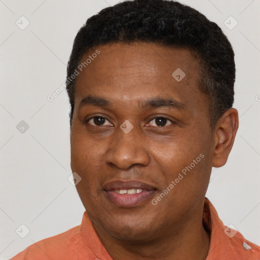 Joyful latino young-adult male with short  brown hair and brown eyes