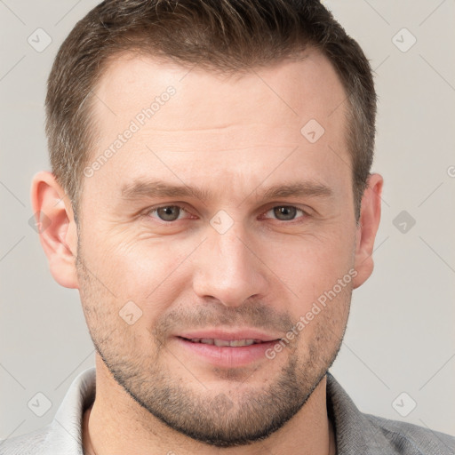 Joyful white adult male with short  brown hair and grey eyes