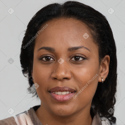 Joyful black young-adult female with medium  brown hair and brown eyes