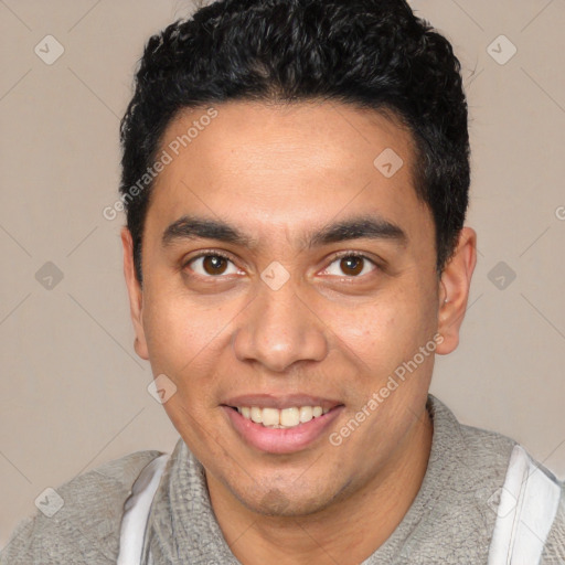 Joyful white young-adult male with short  black hair and brown eyes