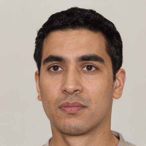 Neutral latino young-adult male with short  black hair and brown eyes