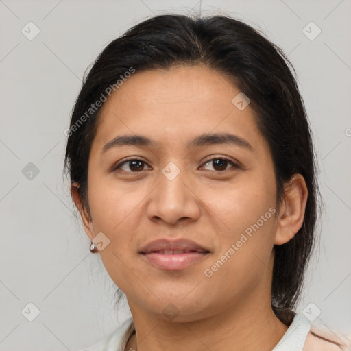 Joyful latino young-adult female with medium  brown hair and brown eyes