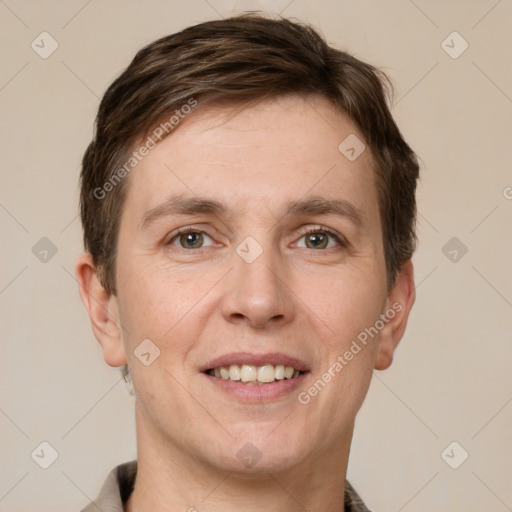 Joyful white adult male with short  brown hair and grey eyes