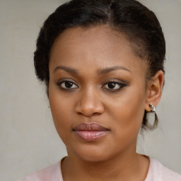 Joyful black young-adult female with medium  brown hair and brown eyes