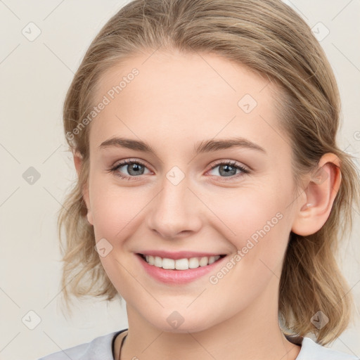 Joyful white young-adult female with medium  brown hair and blue eyes