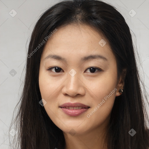 Joyful asian young-adult female with long  brown hair and brown eyes