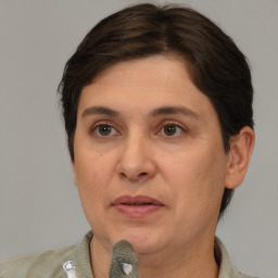 Joyful white adult female with short  brown hair and brown eyes