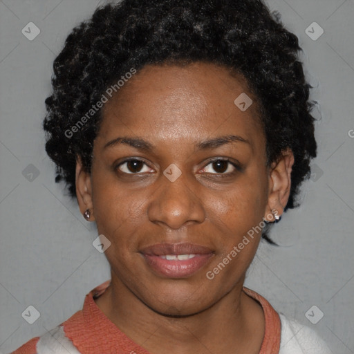 Joyful black young-adult female with short  black hair and brown eyes