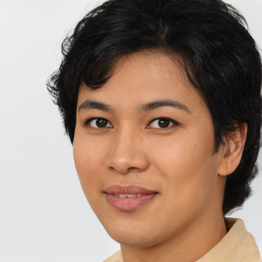 Joyful asian young-adult female with medium  black hair and brown eyes