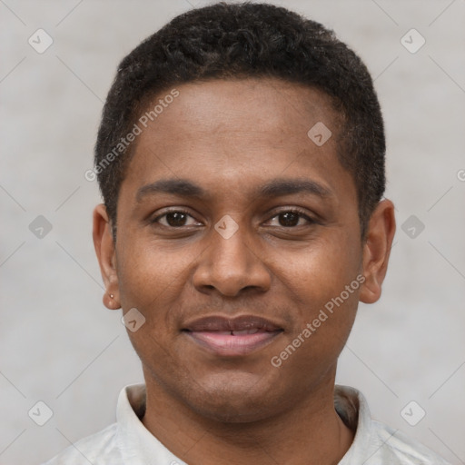 Joyful latino young-adult male with short  brown hair and brown eyes