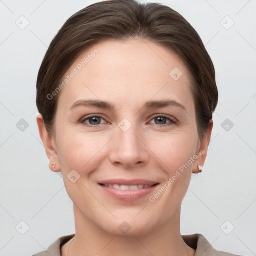 Joyful white young-adult female with short  brown hair and grey eyes