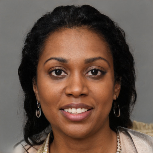 Joyful latino young-adult female with medium  black hair and brown eyes