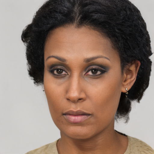 Neutral black young-adult female with long  black hair and brown eyes
