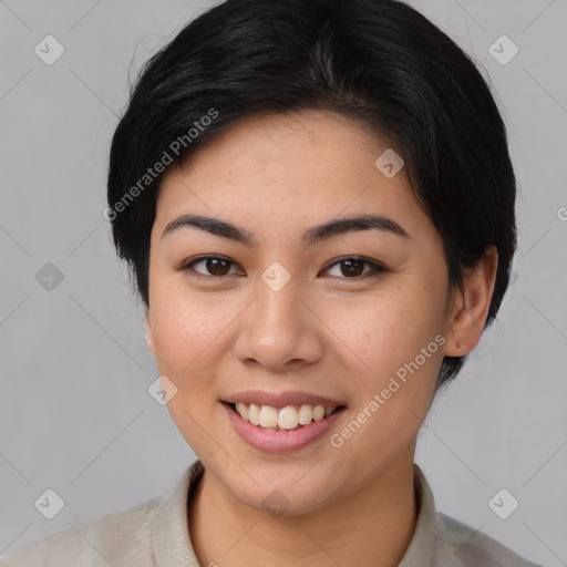 Joyful asian young-adult female with short  brown hair and brown eyes