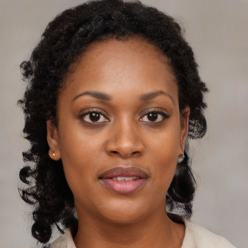 Joyful black young-adult female with medium  black hair and brown eyes