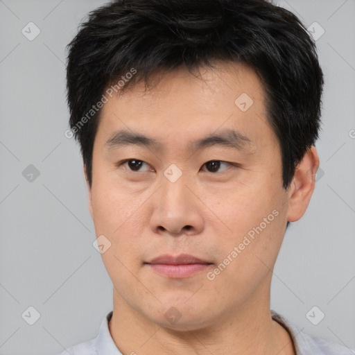 Neutral asian young-adult male with short  black hair and brown eyes