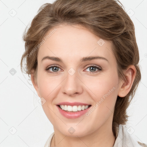 Joyful white young-adult female with medium  brown hair and green eyes