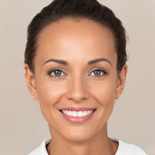 Joyful white young-adult female with short  brown hair and brown eyes