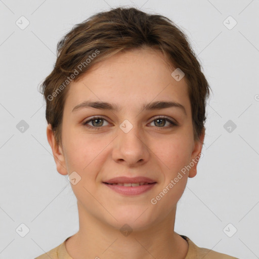 Joyful white young-adult female with short  brown hair and grey eyes