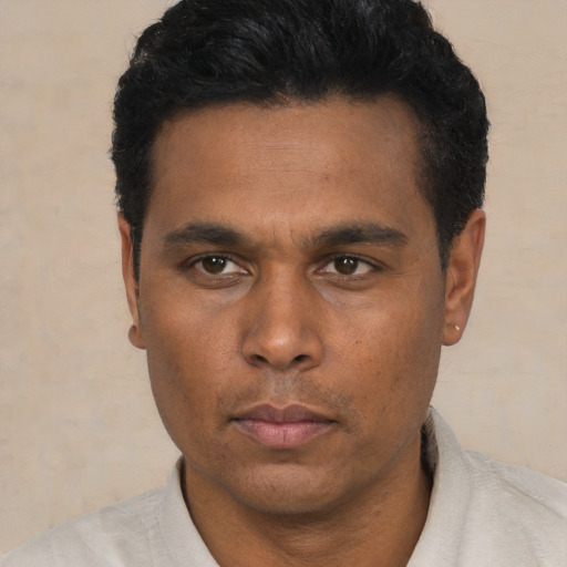 Neutral latino young-adult male with short  black hair and brown eyes