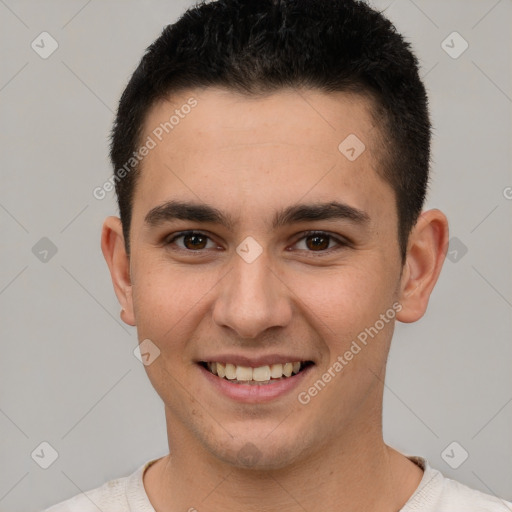 Joyful white young-adult male with short  brown hair and brown eyes