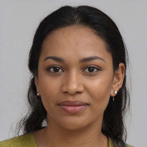 Joyful black young-adult female with medium  brown hair and brown eyes