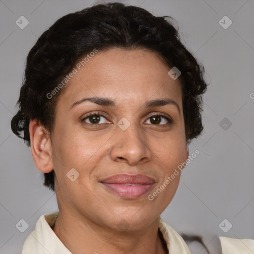 Joyful latino adult female with short  brown hair and brown eyes