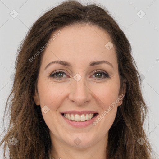 Joyful white adult female with long  brown hair and brown eyes