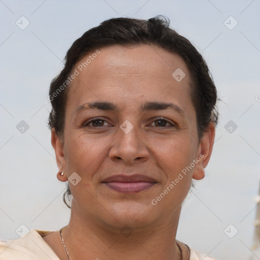 Joyful white adult female with short  brown hair and brown eyes