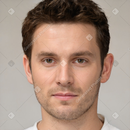 Neutral white young-adult male with short  brown hair and brown eyes