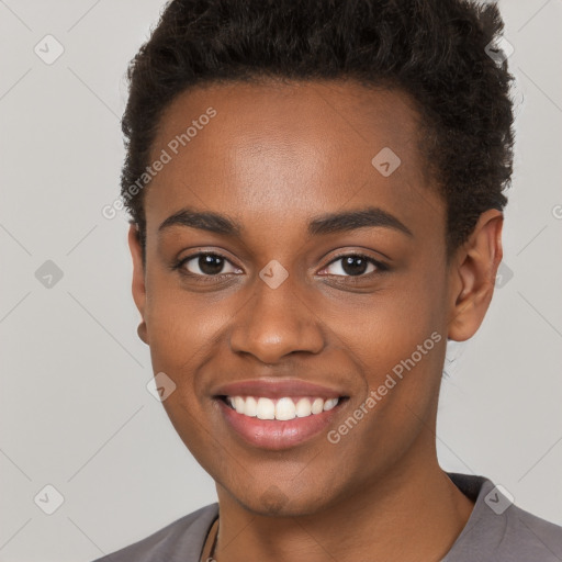 Joyful black young-adult female with short  brown hair and brown eyes