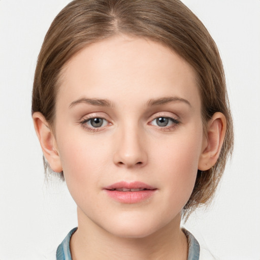 Neutral white young-adult female with medium  brown hair and grey eyes