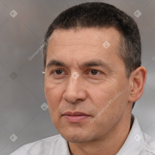 Joyful white adult male with short  black hair and brown eyes