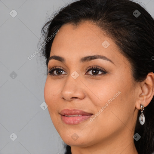 Joyful latino young-adult female with long  brown hair and brown eyes