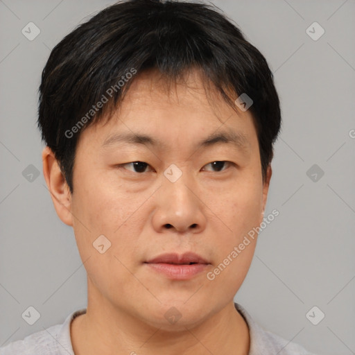 Neutral asian young-adult male with short  brown hair and brown eyes