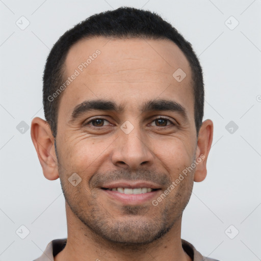 Joyful white young-adult male with short  black hair and brown eyes