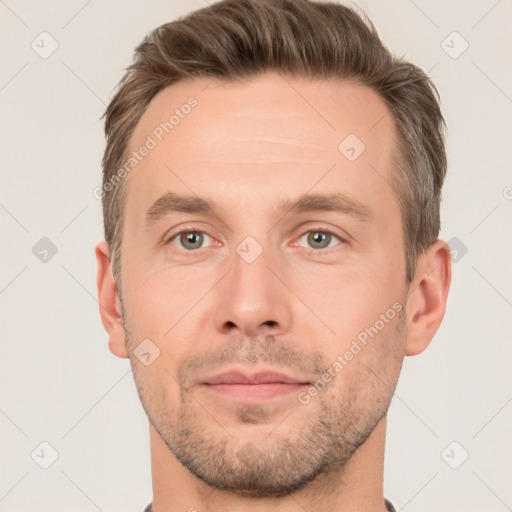 Joyful white adult male with short  brown hair and brown eyes