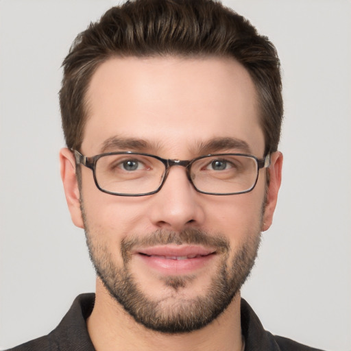 Joyful white young-adult male with short  brown hair and brown eyes