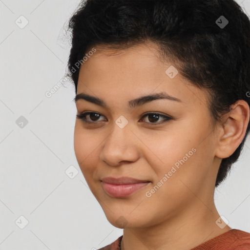 Joyful latino young-adult female with short  black hair and brown eyes