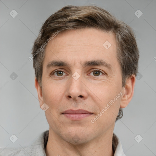 Joyful white adult male with short  brown hair and grey eyes