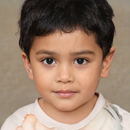 Joyful white child male with short  brown hair and brown eyes