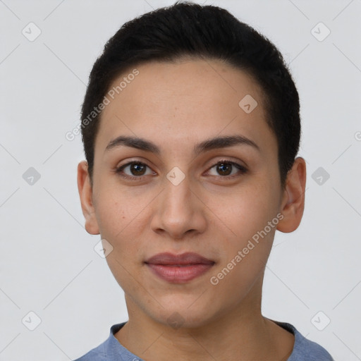 Joyful latino young-adult female with short  brown hair and brown eyes