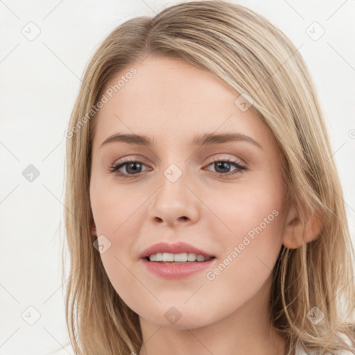 Joyful white young-adult female with long  brown hair and grey eyes